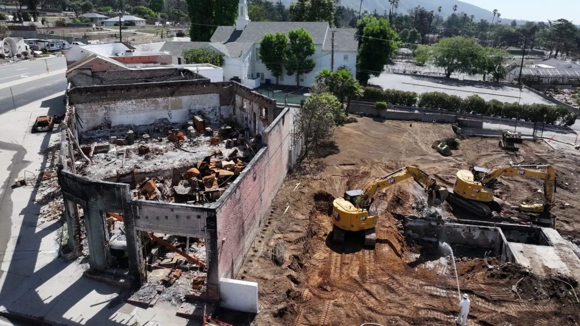 U.S. Army Corps of Engineers contractors clear the remains of a church burned to the ground in the Eaton Fire, as seen in May in Altadena, California. (Mario Tama/Getty Images via Grist)